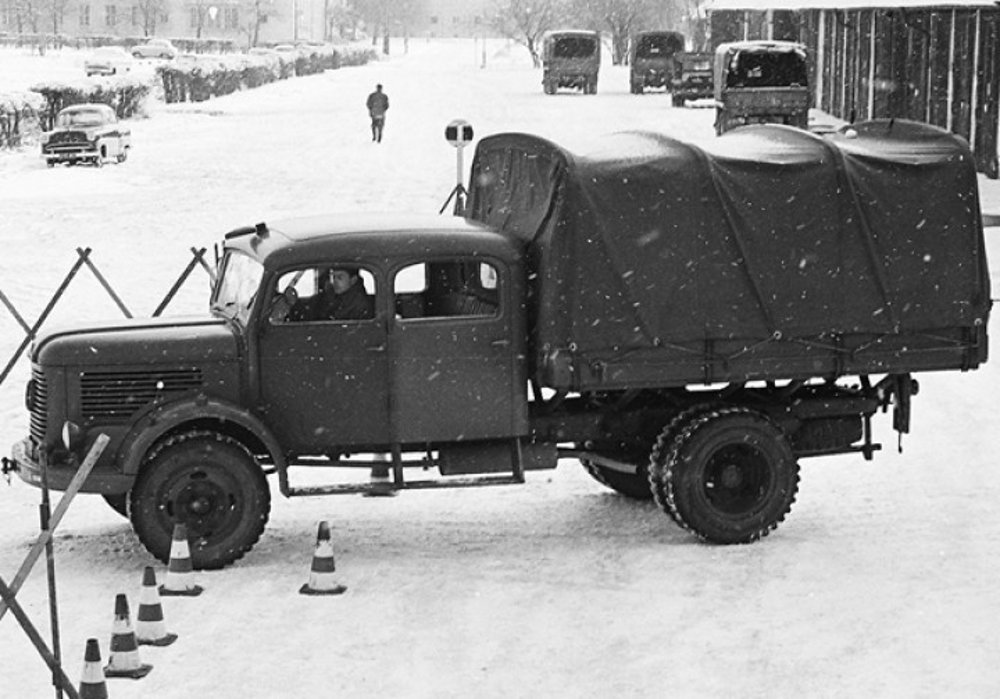 Trainees learning to control the vehicle in tight surroundings in front of the garages of the Army Driving School at the Martinek Barracks