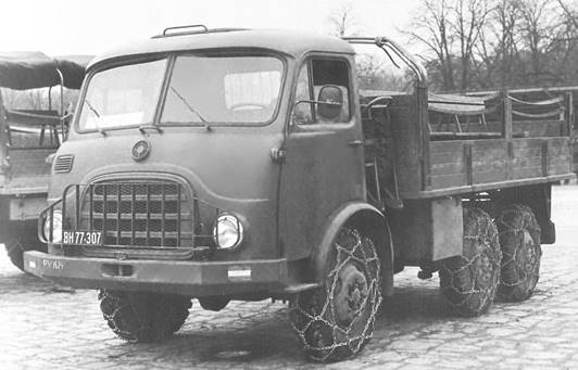 6x6 tipper truck with Palfinger hydraulic loading crane behind the cab during trials at the Army Driving School, late 1960s