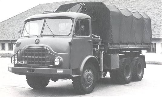 6x6 tipper truck with Palfinger hydraulic loading crane behind the cab during trials at the Army Driving School, late 1960s